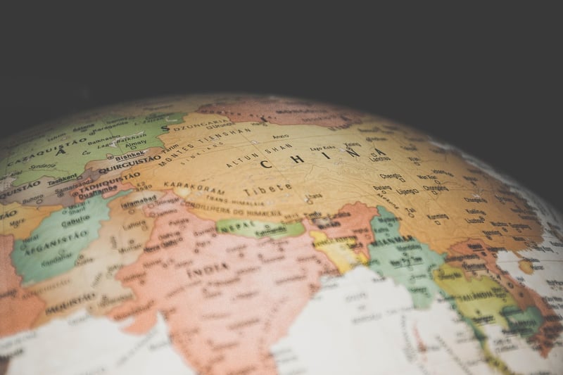Hands holding a world map
